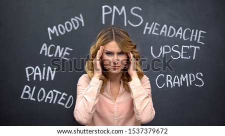 Woman suffering headache due to imaginary problems in pms, hormone imbalance Royalty-Free Stock Photo #1537379672