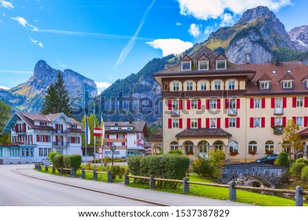 Kandersteg, Switzerland street view with colorful wooden houses in swiss village, Canton Bern, Europe and mountains panorama Royalty-Free Stock Photo #1537387829