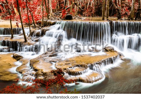 Waterfall and blue emerald water color with autumn theme in Huay mae kamin waterfall 