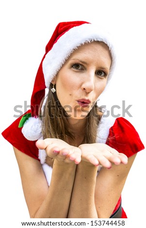 Front view of beautiful miss Santa sending you a kiss. Isolated over white background.