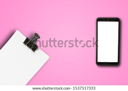 Smartphone on an pink background. flat lay, Top view, with space for text