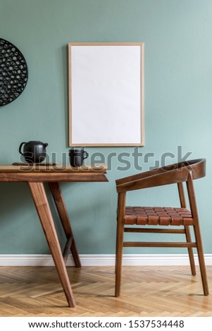 Stylish scandinavian dining room interior with mock up poster frame, wooden table, furniture, teapot with cups, black decoration and elegant accessories. Ready to use. Template.  Modern home decor.