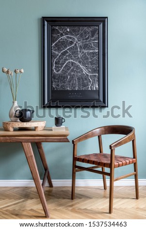 Stylish and design dining room interior with black mock up poster map, wooden table, chair, teapot with cups, flowers in vase, rattan decoration and elegant accessories. Ready to use. Template. 