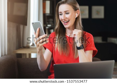Female user checking email on smartphone. Girl receiving important letter in social network account. Young woman watching broadcast online on mobile phone. App with interesting video and audio content Royalty-Free Stock Photo #1537553477