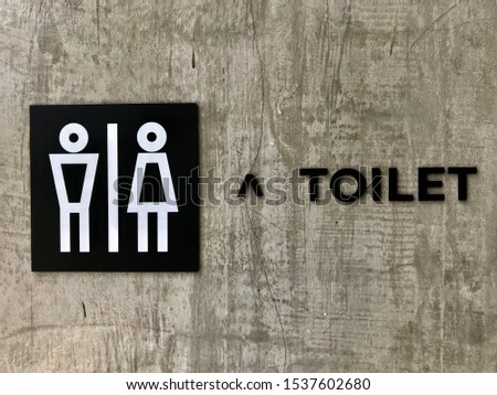 Toilet signs and symbols on concrete background
