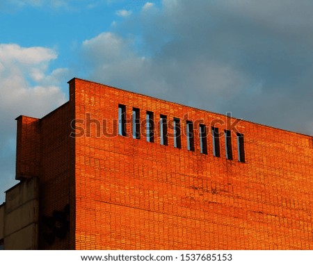 Brick building with dramatic gaps architecture background