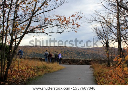 People take in a breathtaking view at Lake of the Clouds in the Porcupine Mountains Region of Ontonagon County, Michigan in October.