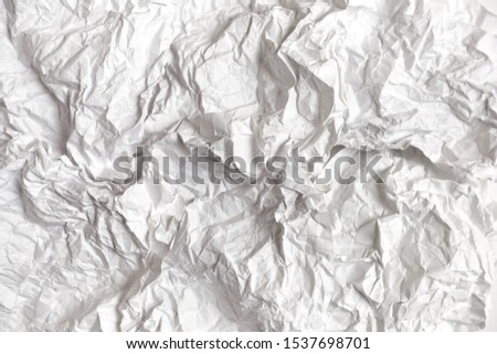 many sheets of crumpled paper with selective focus. Close up