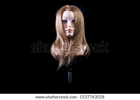 Mannequin head on a black background