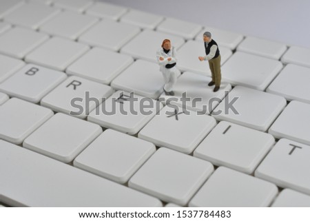Miniature people no deal brexit on keyboard