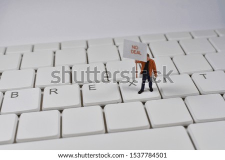 Miniature people no deal brexit on keyboard