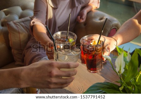 Friends with drinks in pub Royalty-Free Stock Photo #1537791452