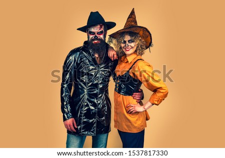 Halloween Party people. Happy gothic couple in Halloween costume. Celebration Halloween