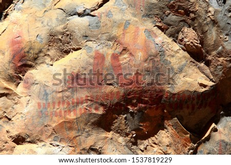 Rock painting in the region of Peruacu River Valley (in Portuguese: "Vale do rio Peruaçu" - State of Minas Gerais - Southeast Brazil. The picture seems to depict feet among other enigmatic drawings.