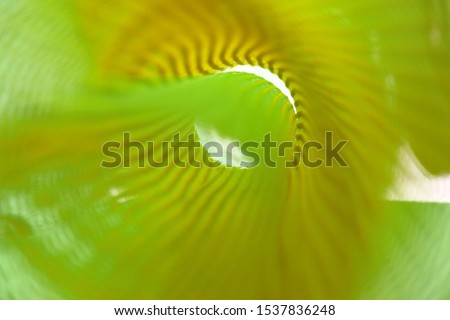 Abstract colorful plastic mesh casting the big shadow on the white soft background surface,blurred plastic,with copy space for text using as background natural, wallpaper concept.