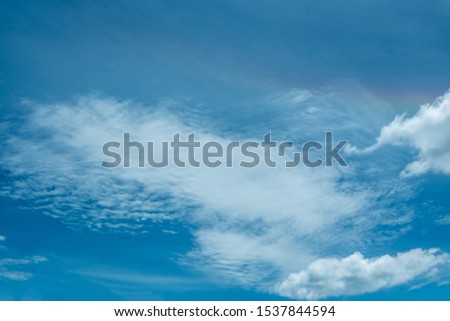 Blue sky and beautiful fluffy clouds in a sunny day. Amazing cloudy sky texture background