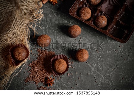 chocolate candies, truffles on a gray background