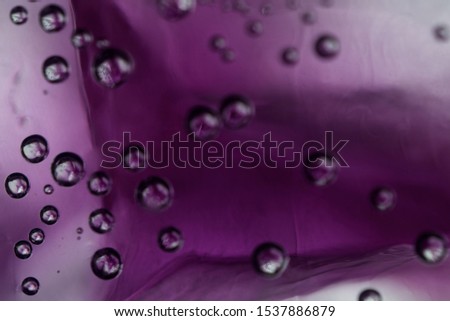 Purple champagne,Effervescent drink. Underwater fizzing air bubbles texture background