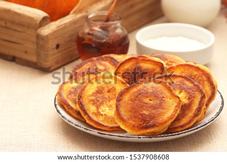 Pumpkin pancakes with cinnamon and honey