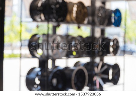 Blur of alloy wheels for cars at the service center