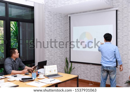 Small and Medium Enterprise Business concept of ,Businessman presenting investment plan to his partner in office.
