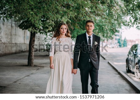 happy bride and groom at a park on their wedding day