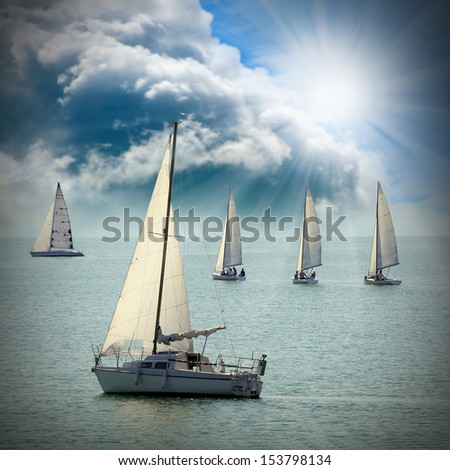 The Sailboats on a sea against a dramatic sky. Retro style picture. 