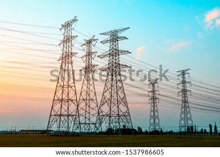 Electricity tower silhouette and sky landscape at dusk Royalty-Free Stock Photo #1537986605