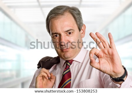 mature businessman showing his hand winning