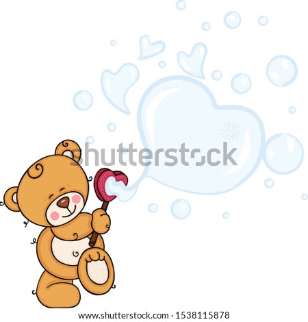 Cute teddy bear blowing soap bubbles

