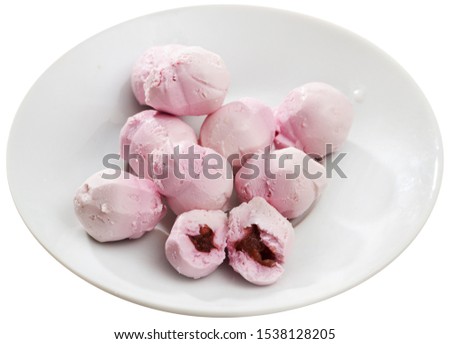 Picture of tasty french goat cheese  stuffed with raspberries at plate. Isolated over white background