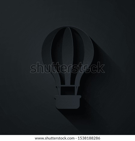 Paper cut Hot air balloon icon isolated on black background. Air transport for travel. Paper art style. Vector Illustration