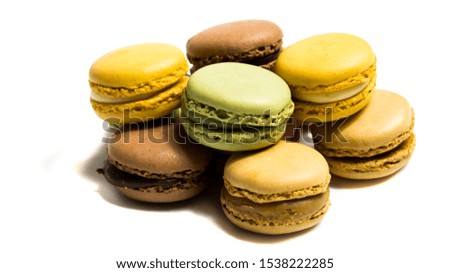 Colored macarons isolated on white background, typical French dish