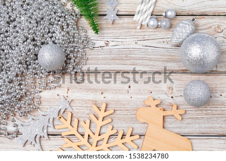 Christmas holiday decorations flatlay on light wooden background