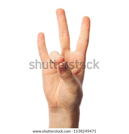 Finger spelling number 7 in American Sign Language on white background. ASL concept