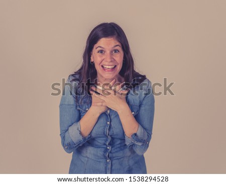 Facial Expression, Human Emotions and celebration. Portrait of beautiful shocked woman celebrating news, winning lottery or having great success with surprised happy face making cheerful gestures.