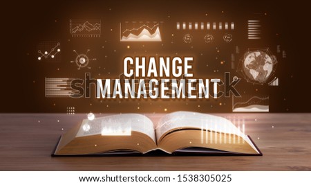 CHANGE MANAGEMENT inscription coming out from an open book, creative business concept