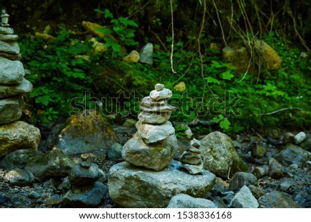 Equilibrium stones  and water games on the  barefoot trail experience  at Hohe Salve mountains, Wilder Kaiser region, Tyrol, Austrian Alps