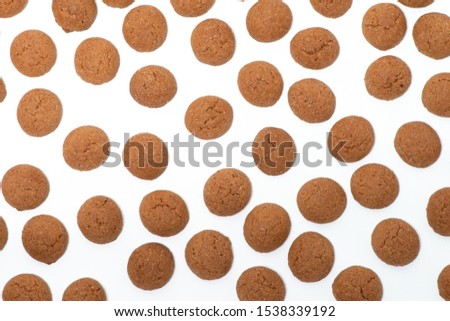 Peppernuts, Pepernoten, Pfeffernüsse, typical Dutch Sinterklaas fest, isolated white background, traditional cookies Royalty-Free Stock Photo #1538339192