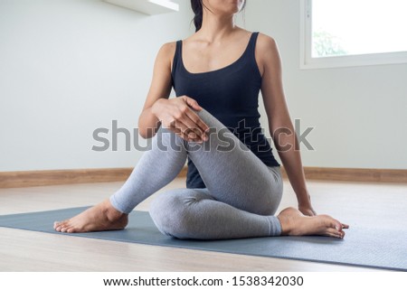 Women are doing seated twist exercises for health and a firmer body. yoga concept Royalty-Free Stock Photo #1538342030