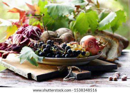 autumn fruits and vegetables on a wooden table