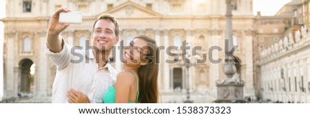 Rome luxury vacation travel honeymoon couple taking selfie picture with mobile phone on vacation in front of Vatican, banner panorama horizontal crop. Tourists lovers on summer holiday, Europe travel.