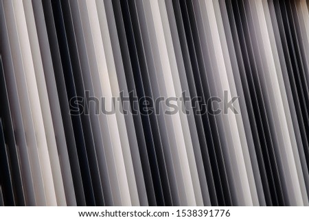 Metal foils in grey scale colors covering a building in Pamplona, Spain