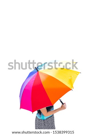 A woman with a rainbow umbrella
