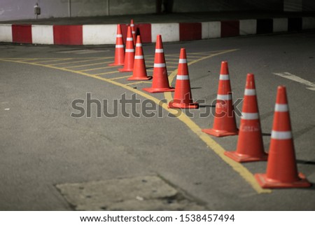 Red cones on the road to prevent accidents.