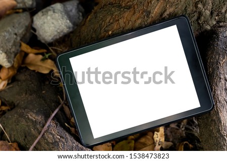The image of the tablet, black machine, white screen with various scenes