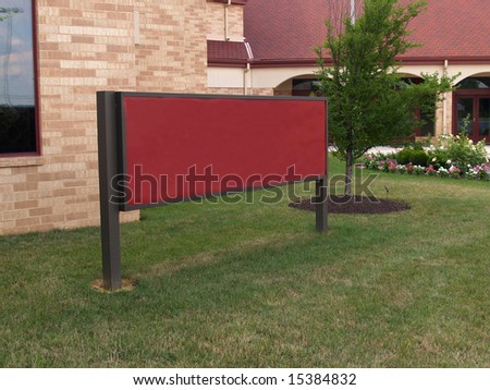 an empty sign outside a brick church