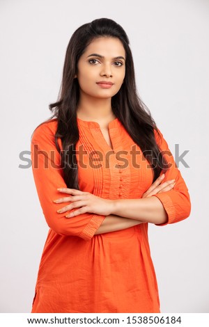 Pretty Hand crossed Indian young women on white. Royalty-Free Stock Photo #1538506184