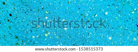 Metallic glitter blue organza cloth texture, close up. Christmas blue gold background. Festive metallic shimmers background in blue green pastel colors, banner.