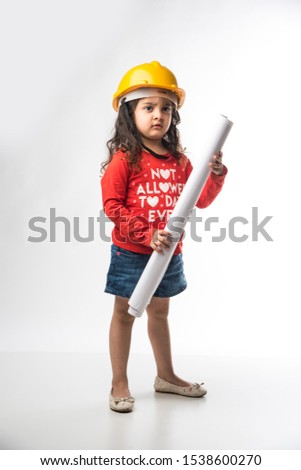 Small Indian girl engineer with yellow hard Hat and Drawing paper roll or plan, isolated over white background